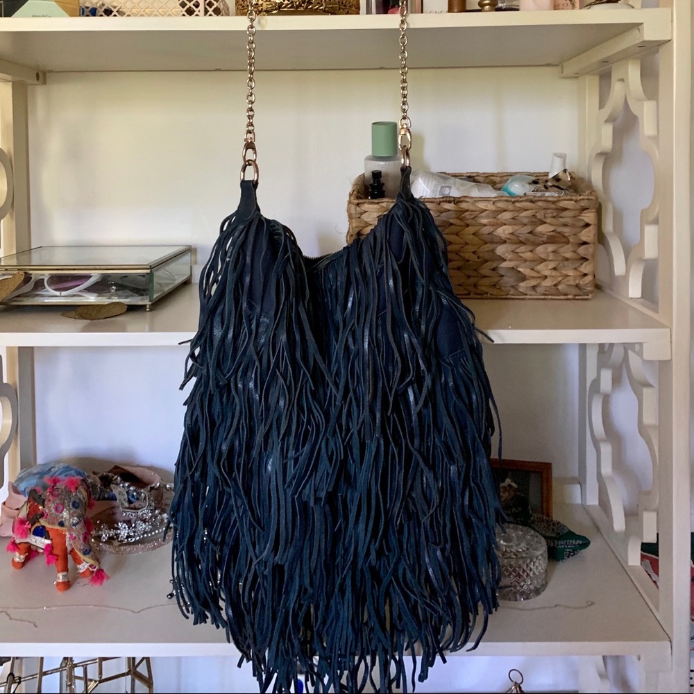 Blue leather fringe purse.  Very spacious!